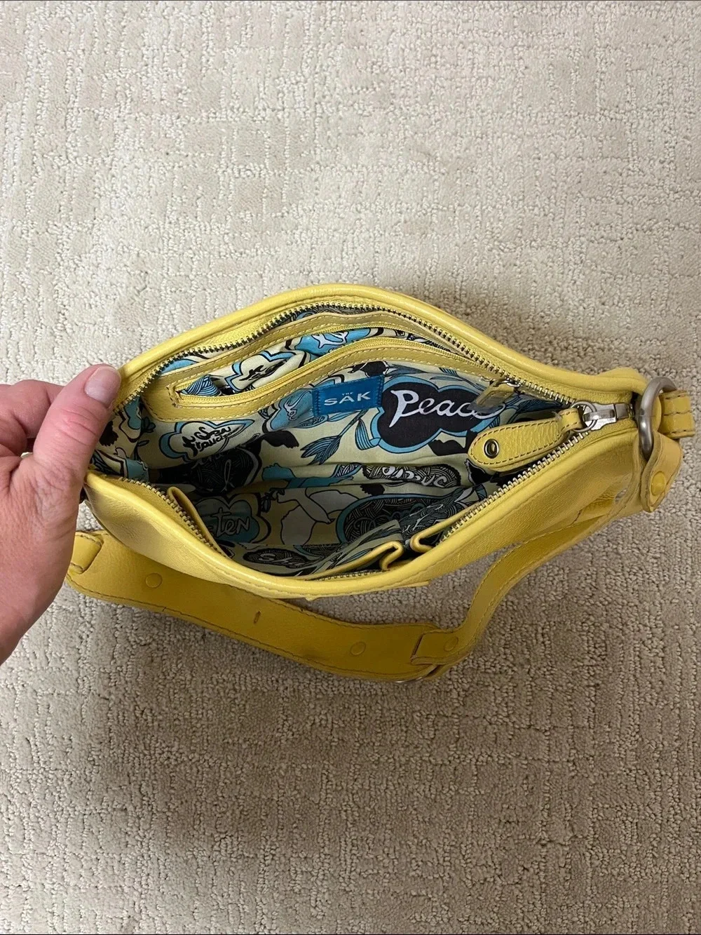 The Sak Yellow Pebbled Leather Shoulder Bag with Silver colored Hardware
